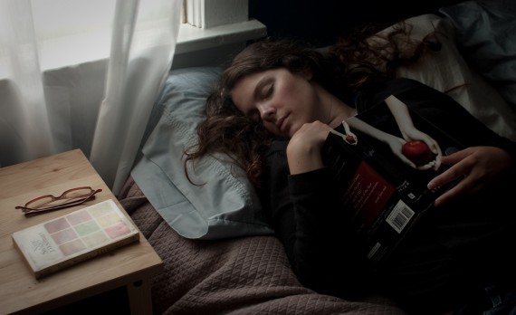 Girl on bed with book
