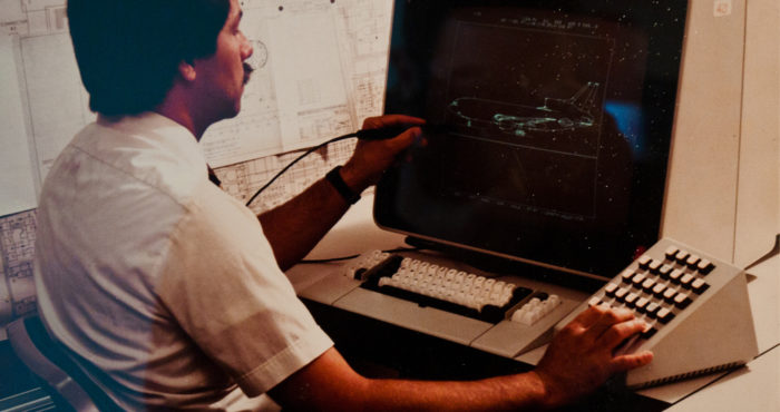 Man Operating a Vintage Computer